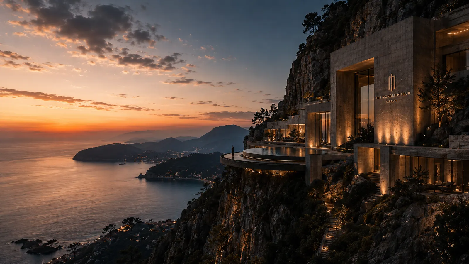 The cliff line above open water, the estate terracing down the rock face toward the sea.